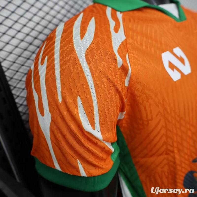 Player Version 2025 Ivory Coast Orange with Elephant Graphic and Green Accents Jersey